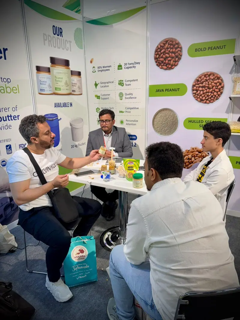 Business meeting at a trade show stand