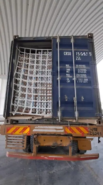 Cargo net fitted across the doors of a loaded 20 ft container