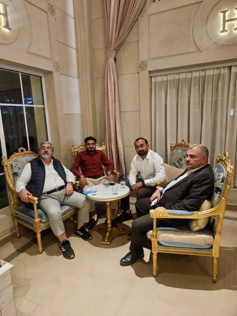 Executive meeting with clients in a hotel lounge