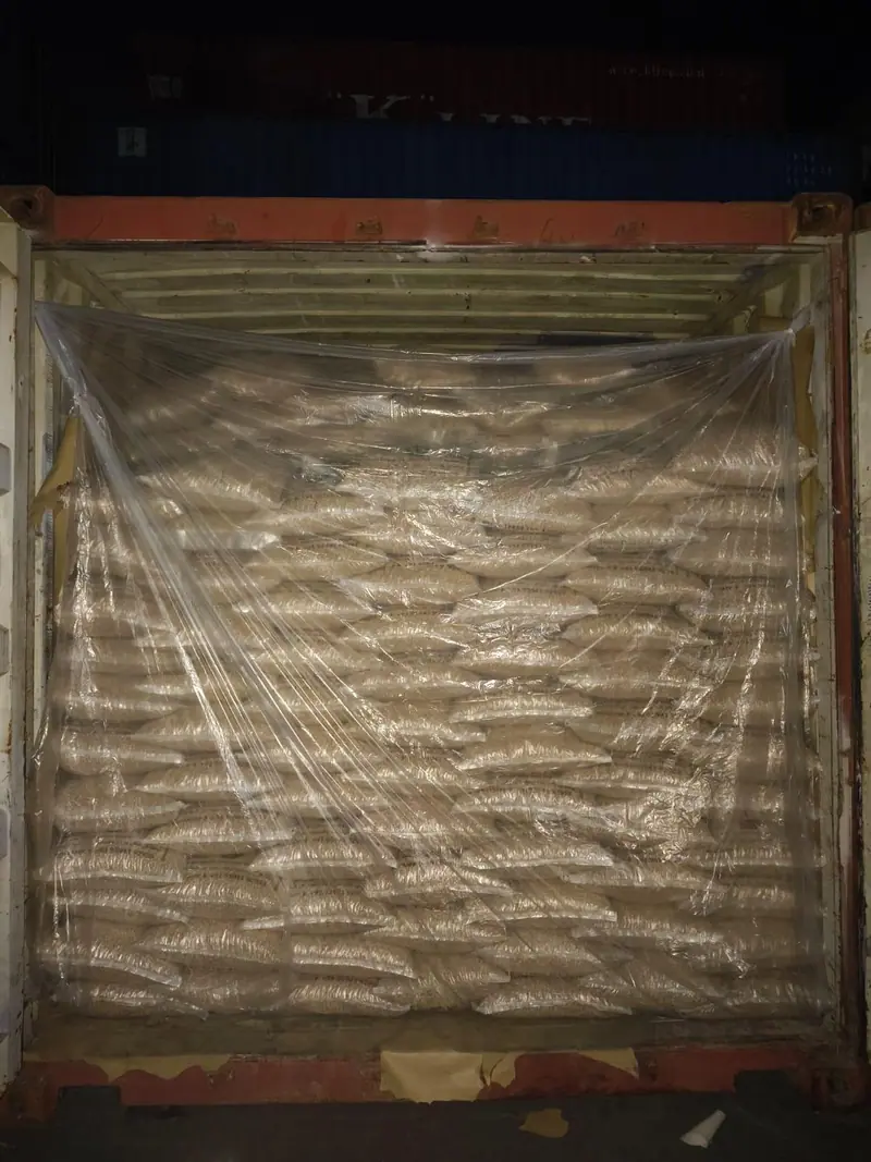 Fully loaded container behind a plastic liner, ready to close