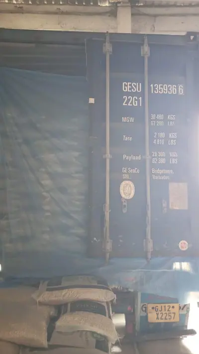 Lined 20 ft container being loaded at the warehouse