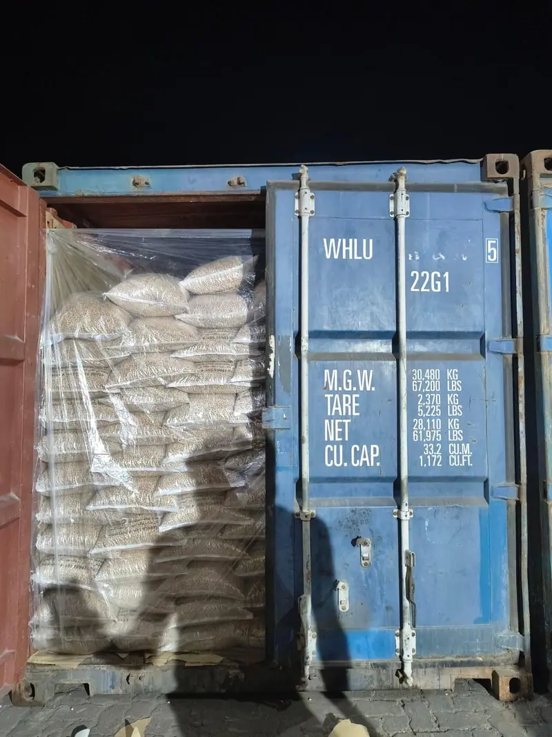 Loading a lined 20 ft container at night