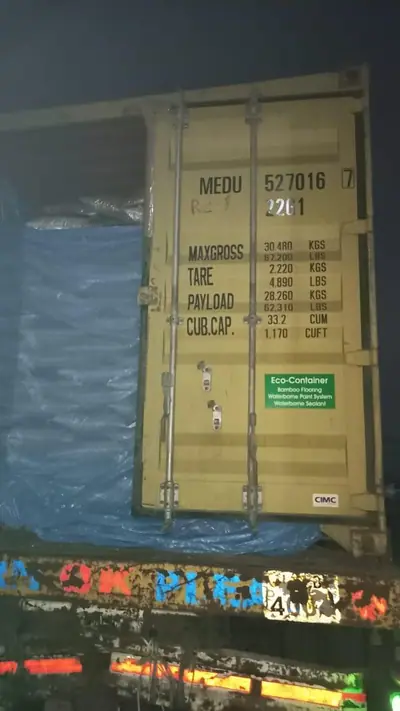 Loading a lined 20 ft MSC container at night