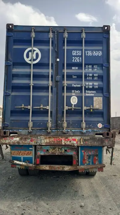 Sealed 20 ft container on a trailer, ready for the port