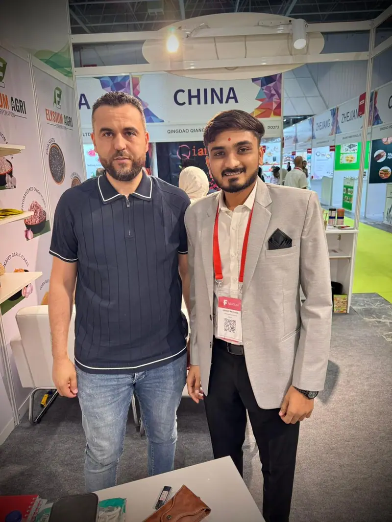 Elysium Agri team member with a buyer at the China pavilion