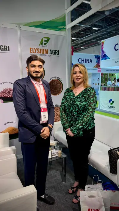 Elysium Agri team member with a visitor at the stand