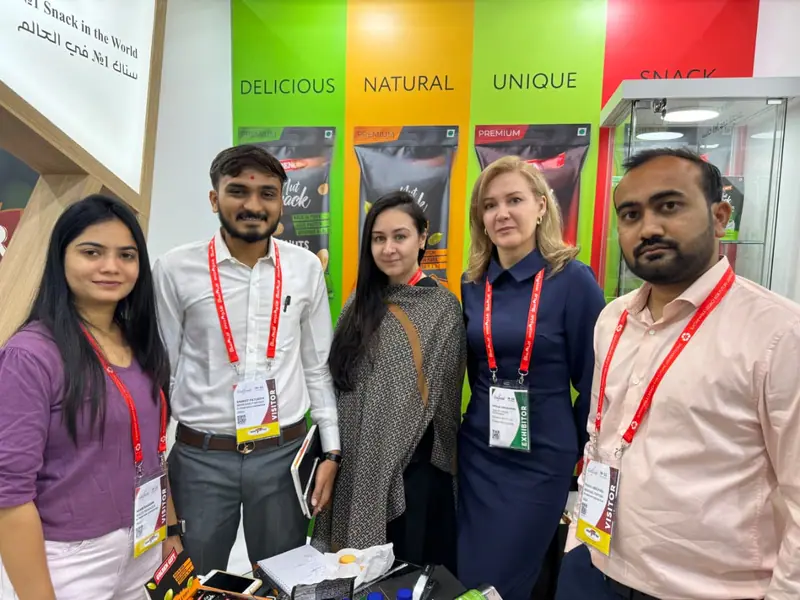 Elysium Agri team with international buyers at a trade show