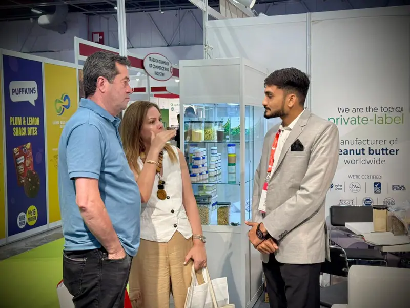Visitors at a trade show stand
