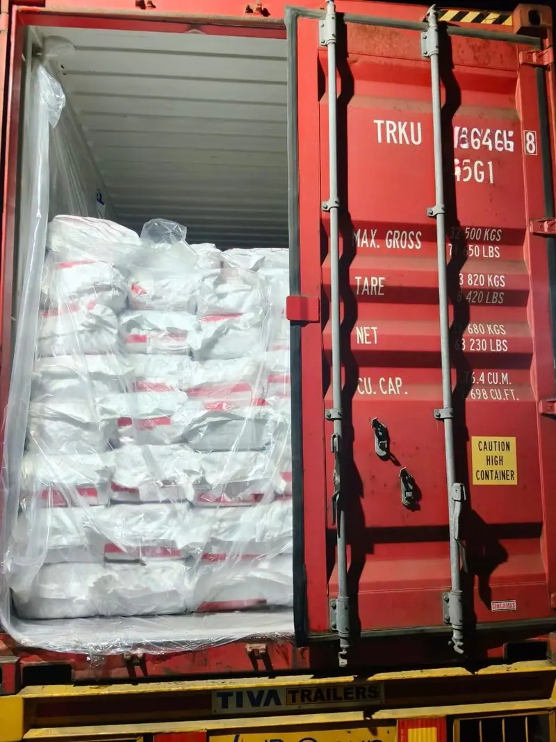 White PP bags in a lined 40 ft high-cube container