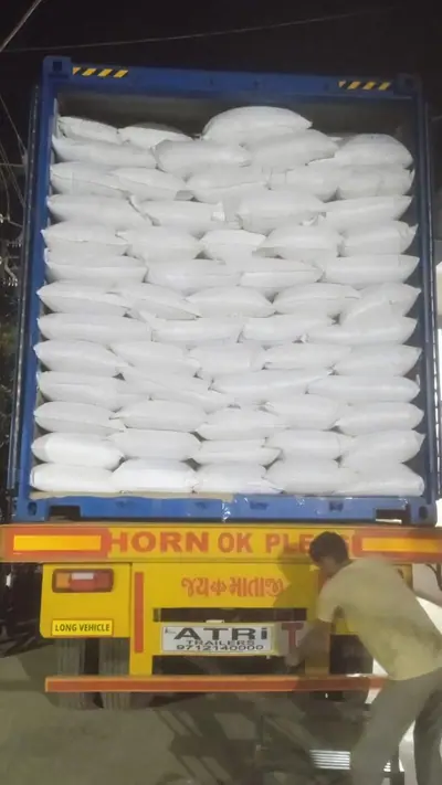 White PP bags stacked to the roof of an export container