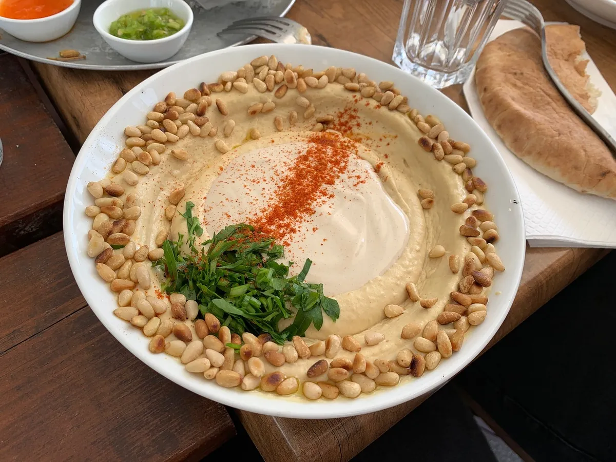 Hummus made from chickpeas with olive oil and herbs
