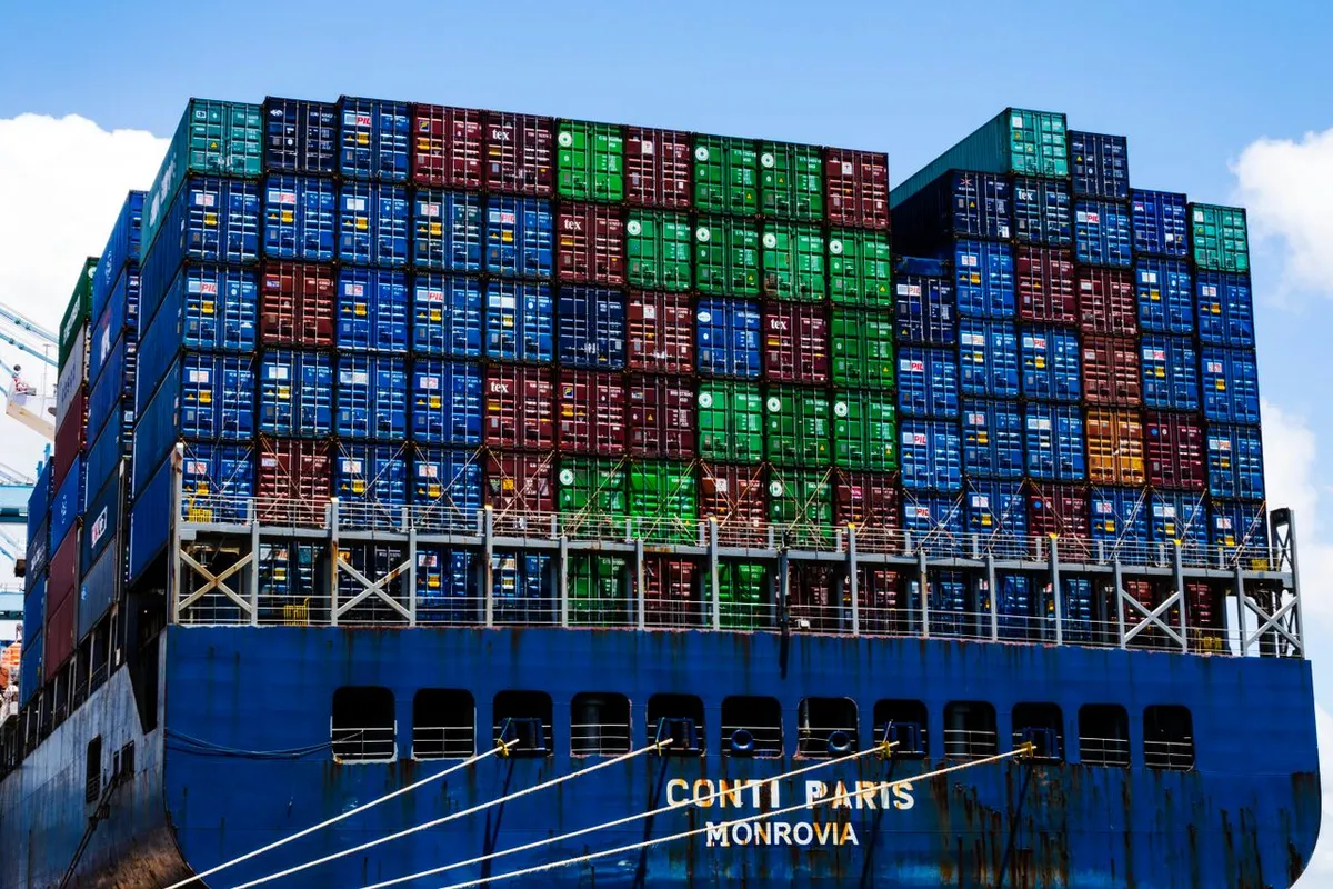 Container ship with stacked containers on deck exposed to temperature swings