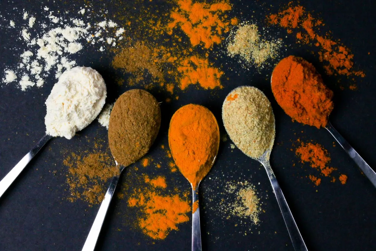 Spoons of seasoning powders including onion powder