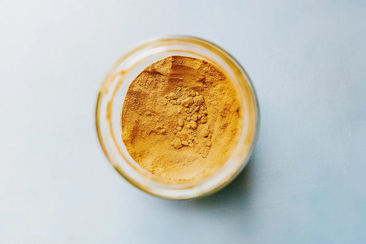 Jar of dehydrated vegetable powder, the form most prone to clumping when it absorbs moisture