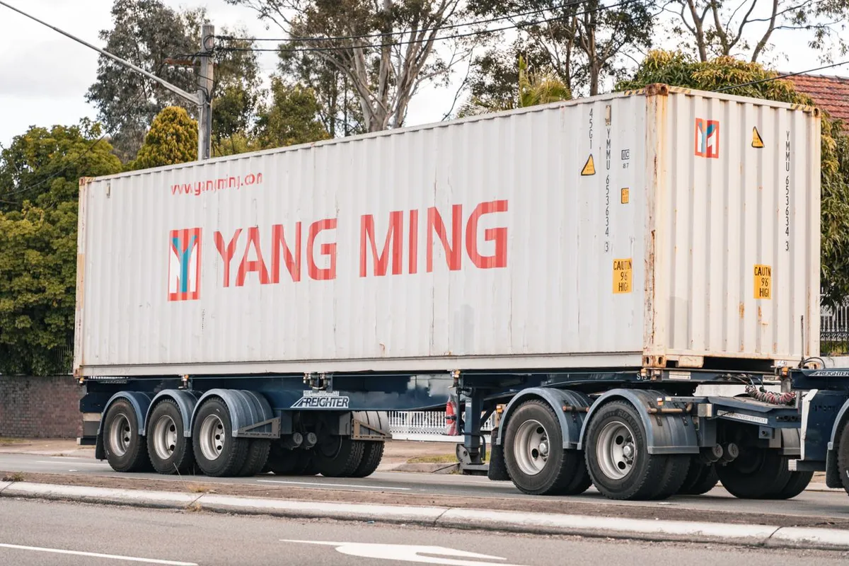 Shipping container on a truck heading to port under FOB terms