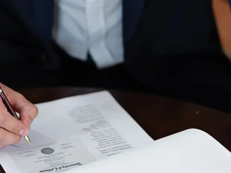 Signing a certificate, representing the FSSAI licence for food export