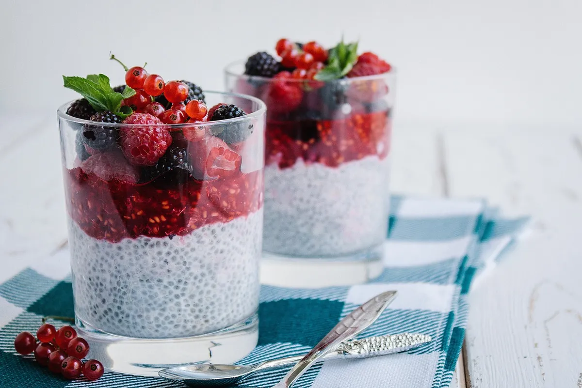 Soaked chia seeds layered with berries in glasses