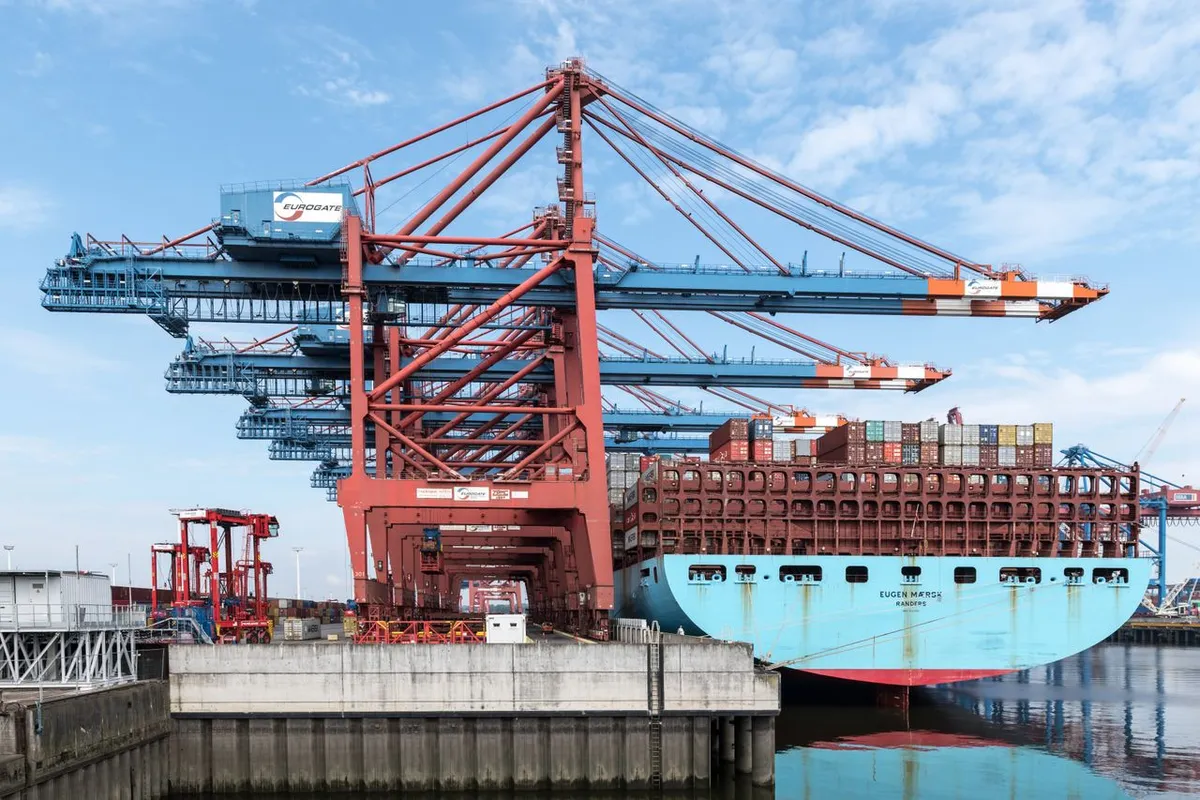 Container ship loading at port under FOB Incoterms
