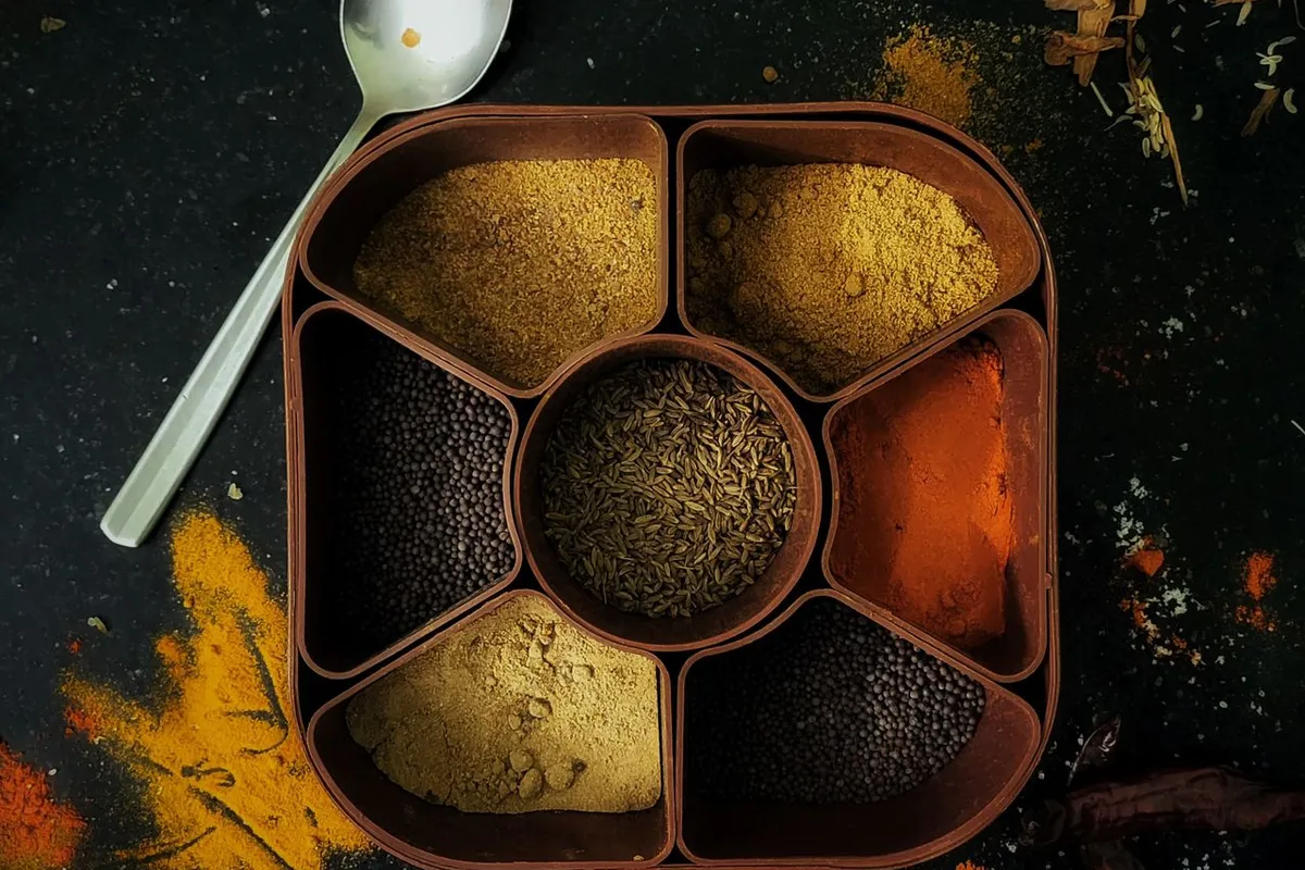 Indian spice box with everyday spices from the list of spices in India
