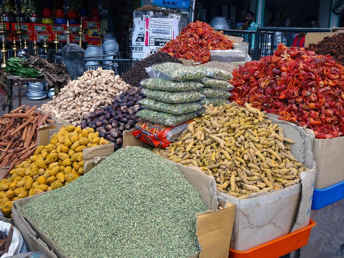 Spice market stall with turmeric, ginger, chilli and seed spices