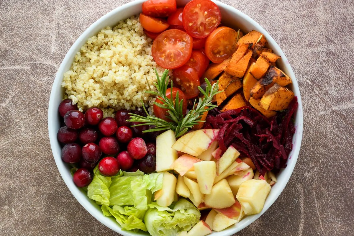 cooked quinoa salad bowl with vegetables