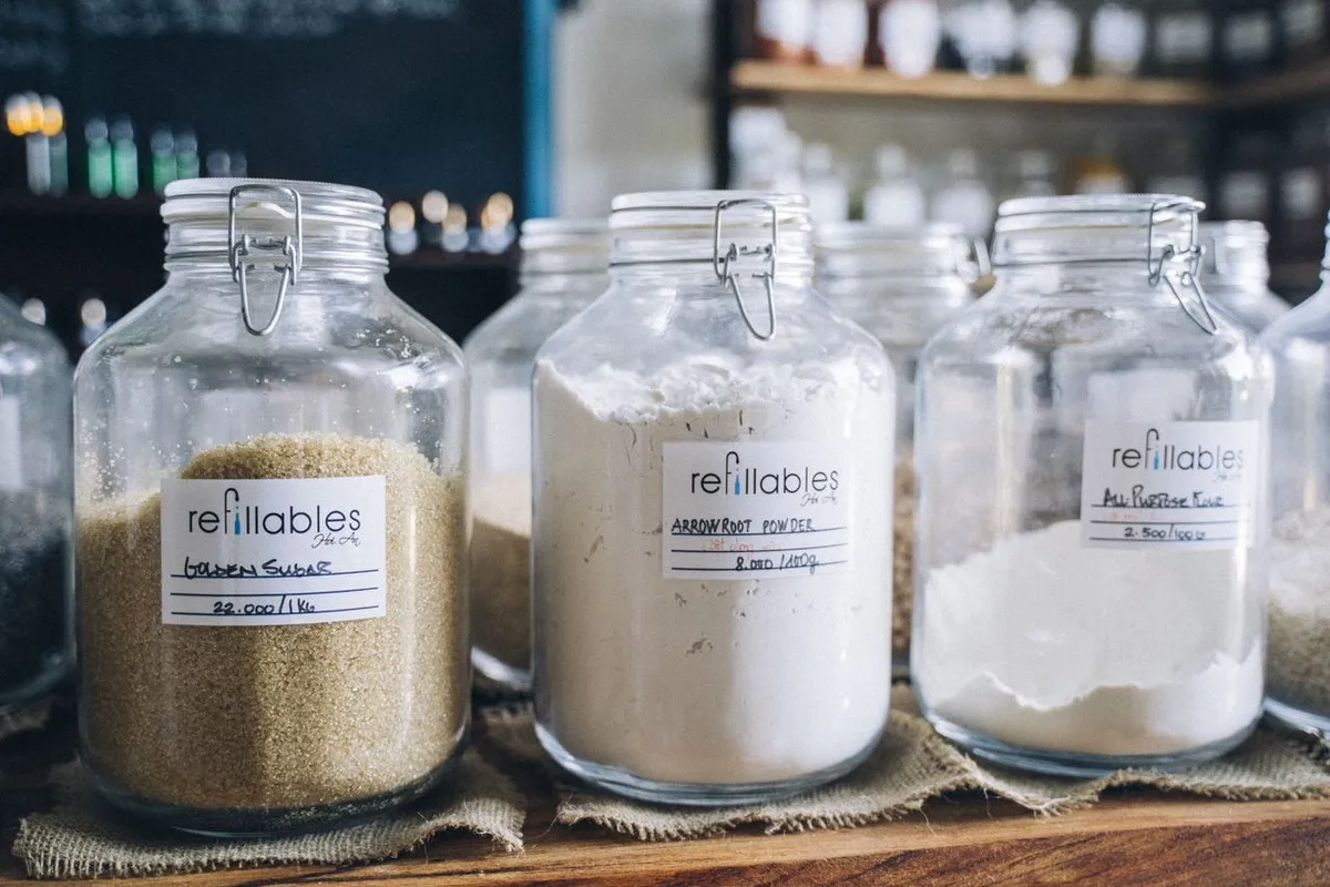 Labelled jars of food ingredients showing allergen information