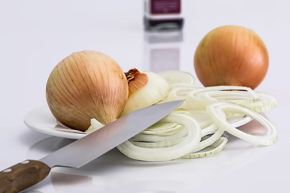 Sliced onions before drying into dehydrated onion flakes