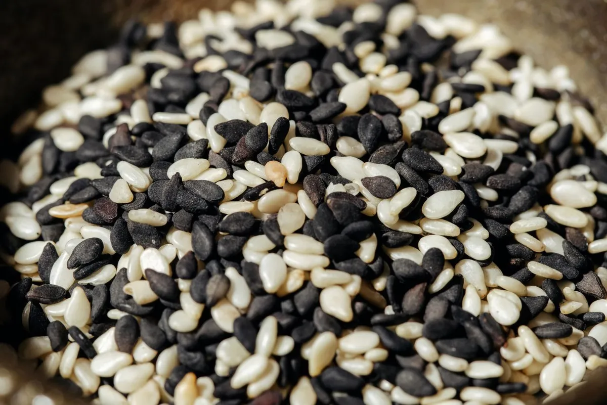 White and black sesame seeds mixed together, ready to eat